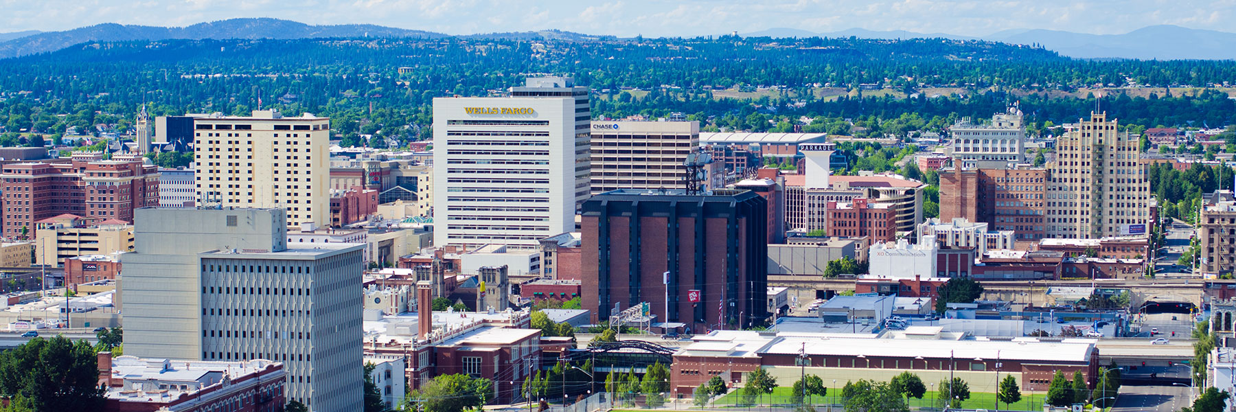 A wide view of the downtown Spokane skyline during the day.